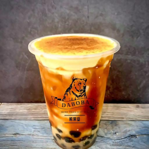 tra-sua-tran-chau-uong-en-kem-trung-chay